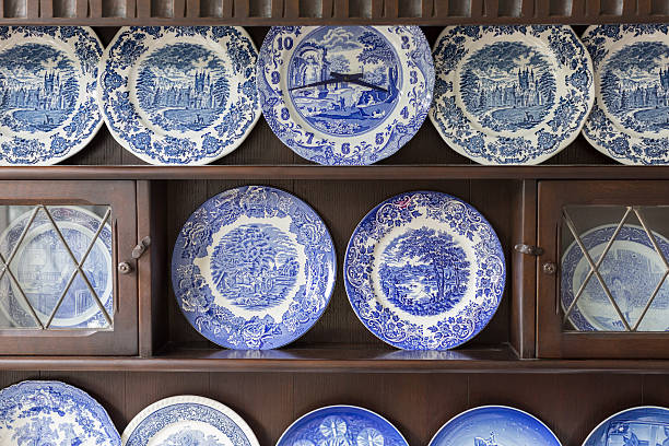 Beautiful plate collection Beautiful plate collection on wooden cabinet . porcelain stock pictures, royalty-free photos & images