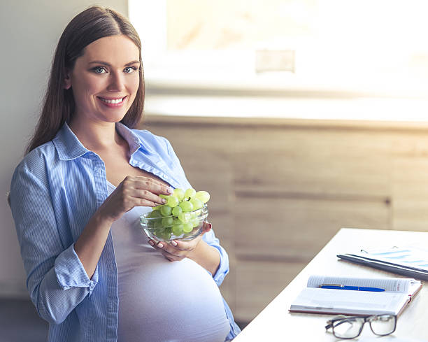 Beautiful pregnant business woman stock photo