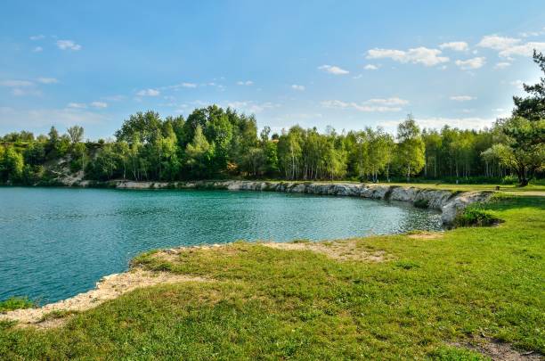 Beautiful quarry with water. Water reservoir in Trzebinia, Poland. lakeshore stock pictures, royalty-free photos & images