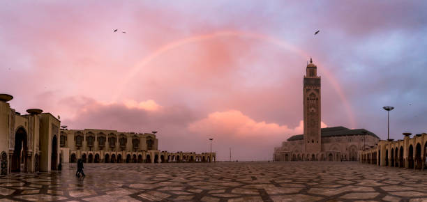 Beautiful rainbow over largest mosque in Morocco The Hassan II Mosque largest mosque in Morocco. Shot after sunset at blue hour in Casablanca. casablanca morocco stock pictures, royalty-free photos & images