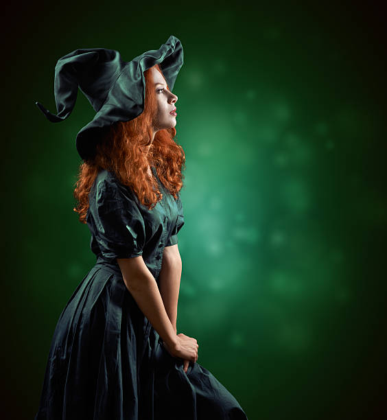 beautiful red-haired girl in  costumes witch beautiful red-haired girl in green costumes witch blurred background ugly skinny women stock pictures, royalty-free photos & images