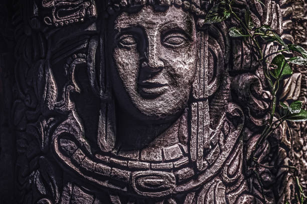 Beautiful rocky monument with a carved image of a human face in the jungle Beautiful rocky monument with a carved image of a human face in the jungle. Close-up view aztec civilization stock pictures, royalty-free photos & images