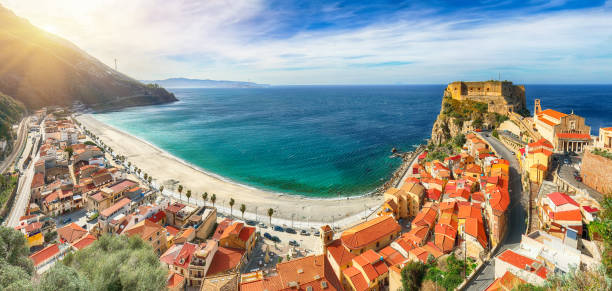 Beautiful seaside town village Scilla with old medieval castle on rock Castello Ruffo stock photo