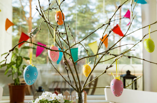 Beautiful served round table with decorations in dining room for Easter celebration stock photo