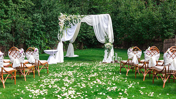 Beautiful setting for outdoors wedding ceremony Beautiful setting for outdoors wedding ceremony waiting for bride and groom and guests. Decoration wedding ceremony stock pictures, royalty-free photos & images