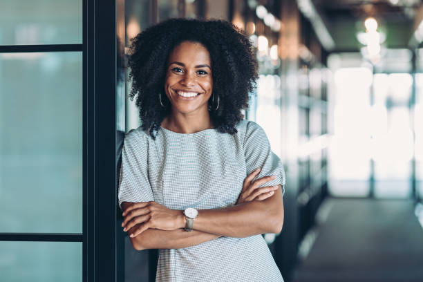 Beautiful smiling African ethnicity businesswoman Portrait of a smiling businesswoman achievement photos stock pictures, royalty-free photos & images