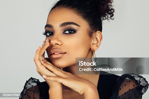 istock Beautiful smiling girl with curly hairstyle 1335037582