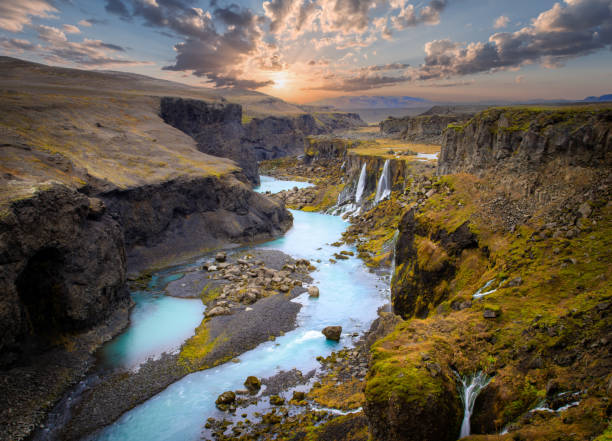 Beautiful sunset and landscape of Sigoldugljufur canyon with many small waterfalls and the blue river in Highlands of Iceland stock photo