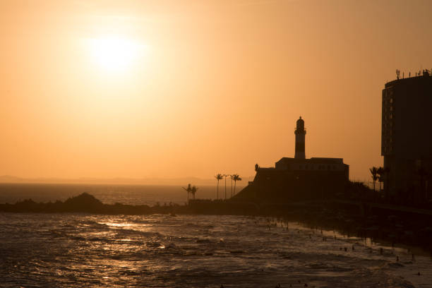 Beautiful sunset at Barra Lighthouse in Salvador Bahia, Brazil. stock photo