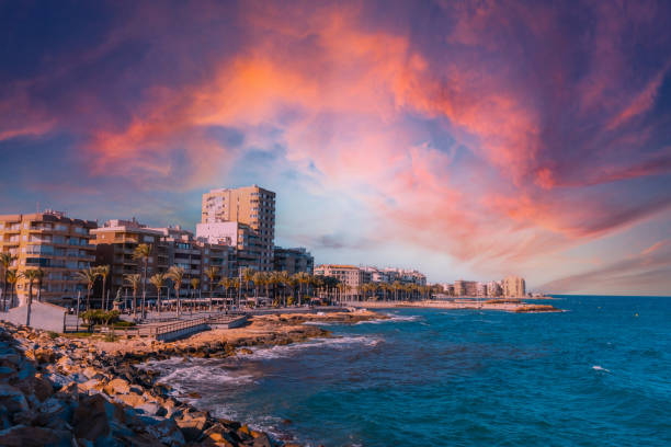 A beautiful sunset in the coastal city of Torrevieja, Alicante, Valencian Community. Spain, Mediterranean Sea A beautiful sunset in the coastal city of Torrevieja, Alicante, Valencian Community. Spain, Mediterranean Sea alicante province stock pictures, royalty-free photos & images
