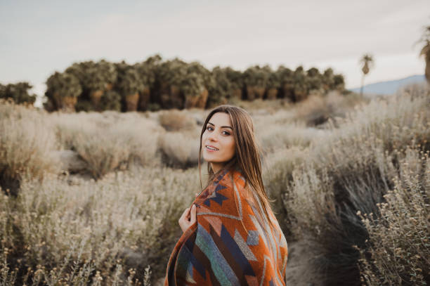 Beautiful traveler girl in gypsy look in desert nature Boho woman in the desert nature.  Artistic photo of young hipster traveler girl in gypsy look, vlad model photos stock pictures, royalty-free photos & images