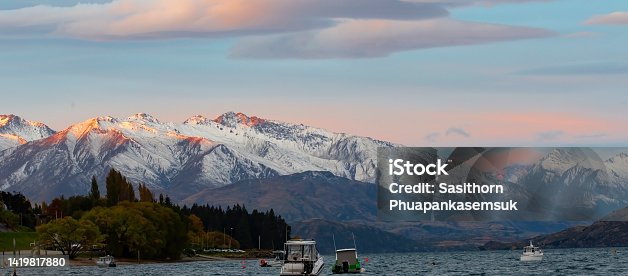 istock Beautiful view alpine landscape panorama with snow view in the evening mountain as lake at autumn scene 1419817880