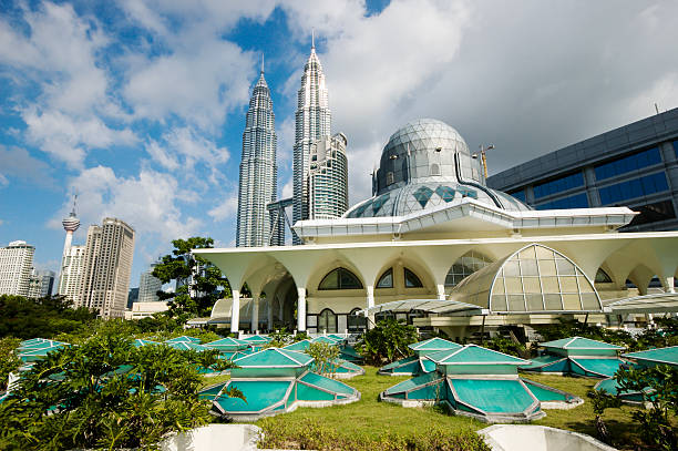 Beautiful view on Asy-Syakirin Mosque with Petronas Towers Asy-Syakirin Mosque with Petronas Towers in background, also seen is the KL Tower. kuala lumpur stock pictures, royalty-free photos & images