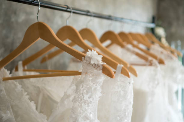 beautiful wedding dresses on a hanger stock photo