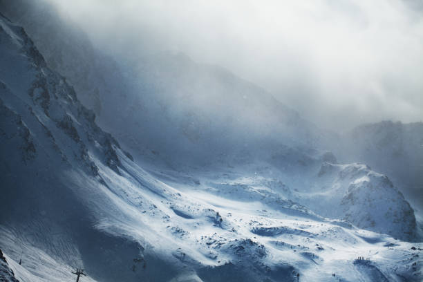 Beautiful winter mountains on stormy weather Aerial view of snowy mountains at winter day. Stormy weather, Canillo ski region, Andorra blizzard stock pictures, royalty-free photos & images