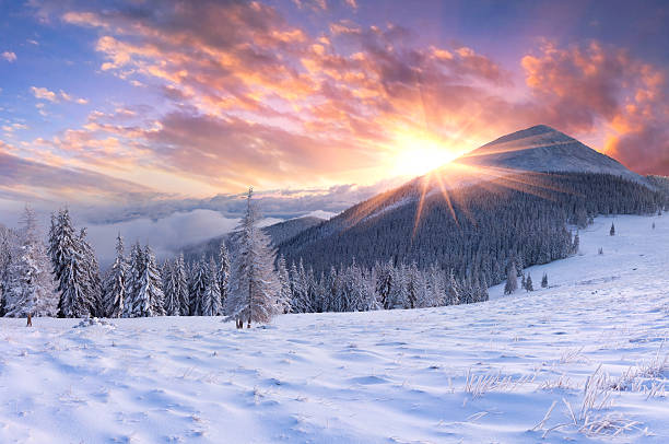 Beautiful winter sunrise in the mountains. stock photo