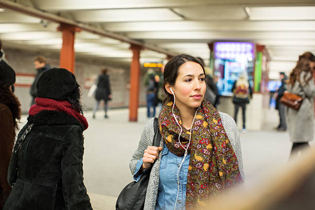 beautiful woman at subway station during rush hour - subway snapshot stockfoto's en -beelden