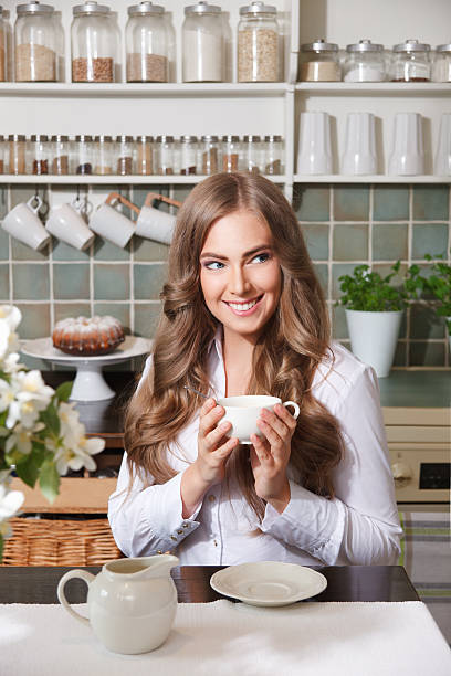Beautiful woman drinking coffee stock photo