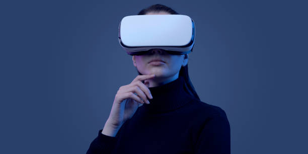 Beautiful woman experiencing virtual reality stock photo