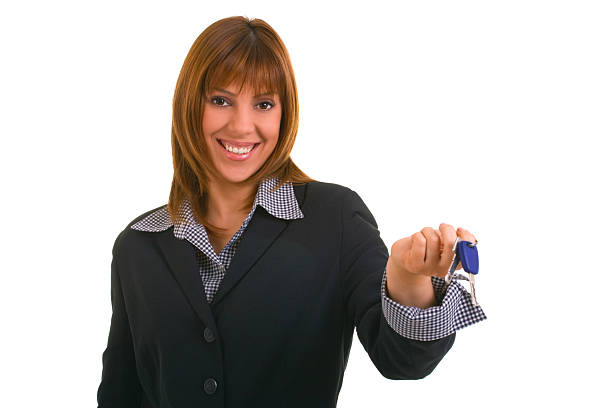 Beautiful woman holding keys stock photo