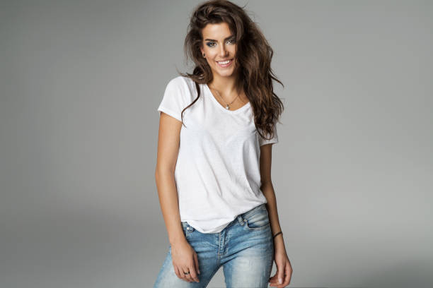Beautiful woman Smiling female model isolated on grey background white t shirt stock pictures, royalty-free photos & images
