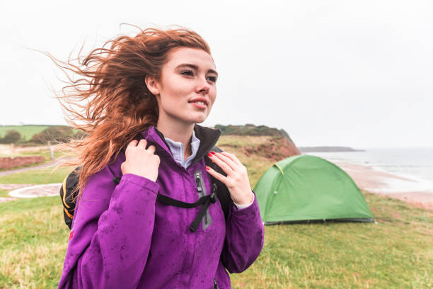 Beautiful woman portrait on hiking and camping trip stock photo