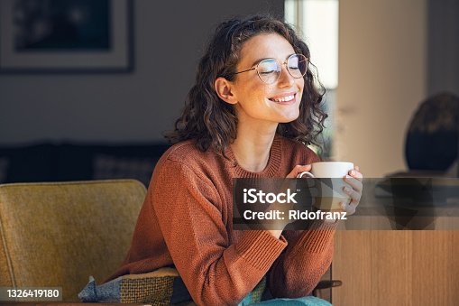 istock Beautiful woman relaxing and drinking hot tea 1326419180