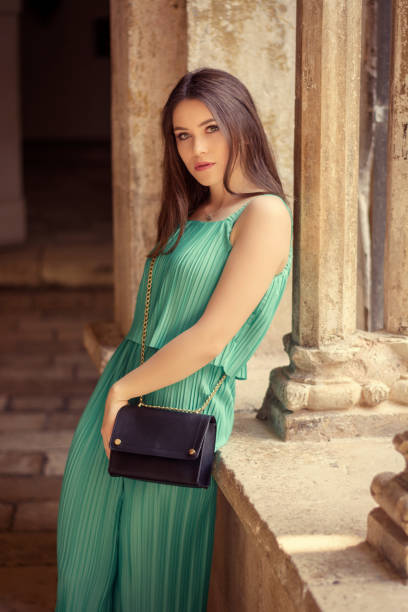 Beautiful woman wearing green dress stock photo