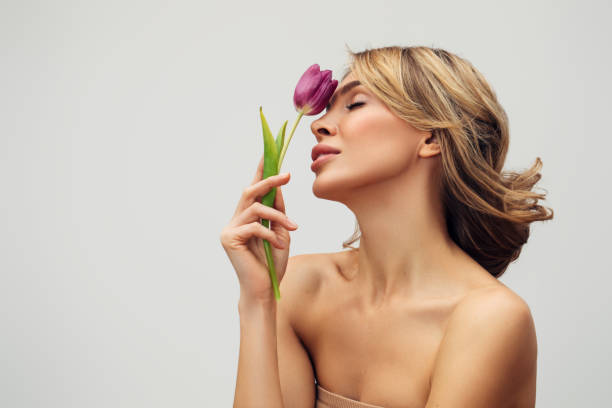 Beautiful woman with a flower stock photo