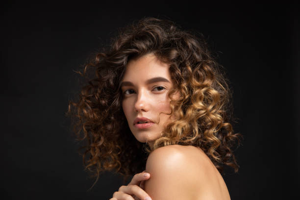 Beautiful woman with curly hair stock photo