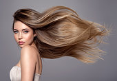 istock Beautiful woman with long straight hair. Blond girl. 1312807901