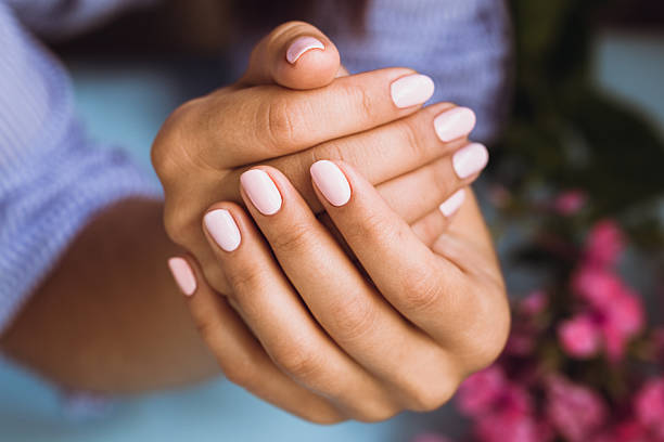 Beautiful woman's nails with beautiful pink manicure Beautiful woman's nails with beautiful pink manicure manicure stock pictures, royalty-free photos & images