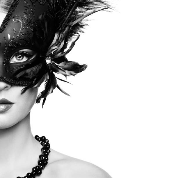 beautiful young woman in black mysterious venetian mask - carnival mask imagens e fotografias de stock
