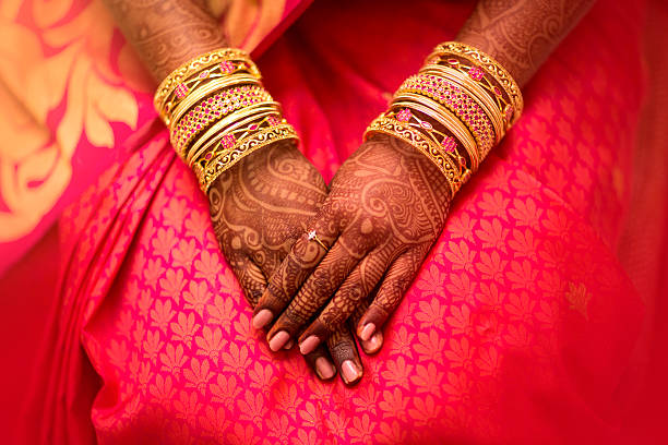 beautifully decorated Indian bride hands. Mehndi, application of henna as skin decoration in Indian Wedding. indian bride stock pictures, royalty-free photos & images