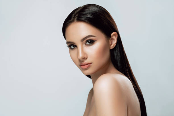 Beauty portrait. Brunette woman with tanned skin and brown eyes and fresh healthy skin. Beauty portrait. Brunette woman with tanned skin and brown eyes and fresh healthy skin. beautiful asian woman face stock pictures, royalty-free photos & images