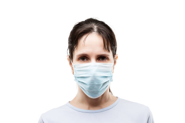 Beauty young woman wearing respiratory protective medical mask stock photo