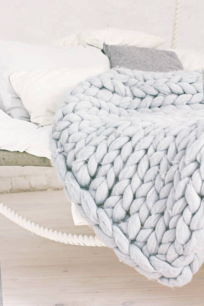 Bed, Scandinavian style, gray plaid. stock photo
