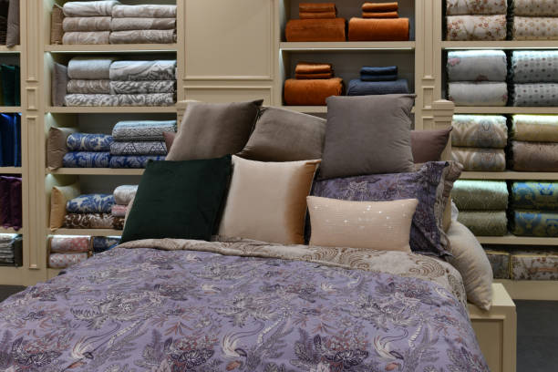 Bed with pillows in the interior of the store stock photo