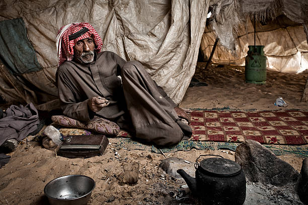 Bedouin resting in his tent. stock photo