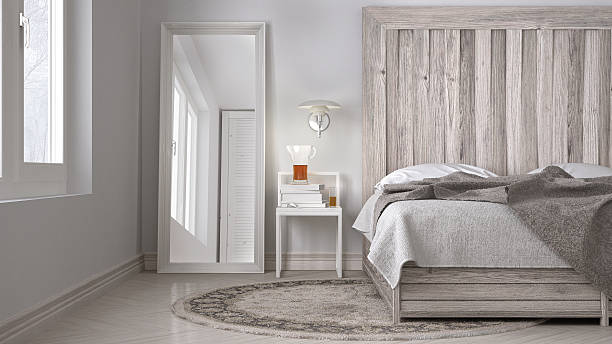 DIY bedroom, bed with wooden headboard, scandinavian white eco c stock photo