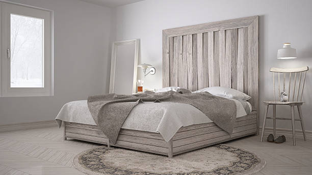 DIY bedroom, bed with wooden headboard, scandinavian white eco c stock photo