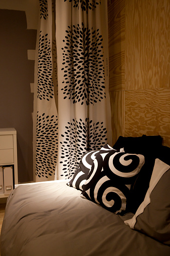 Bedroom With Black And White Decor Wood Paneling Stock Photo