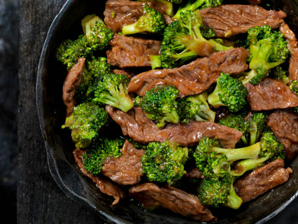 Beef and Broccoli Stir Fry Beef and Broccoli Stir Fry in a Cast Iron Skillet beef stock pictures, royalty-free photos & images