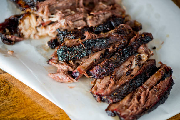 Beef Brisket barbecue Traditional Texas Smoke House . Rubbed with spiced & slow smoked in a classic Texas smoke house over mesquite wood chips in traditional classic bbq method. Chopped Beef Brisket. stock photo