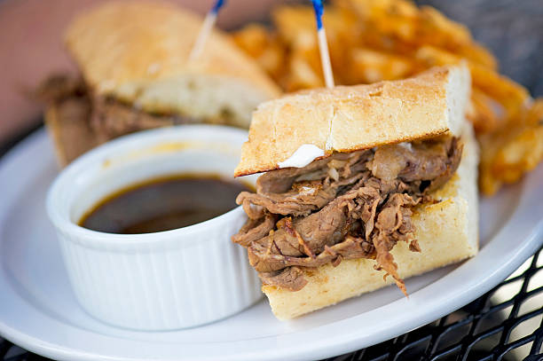 Beef Dip A classic beef dip sandwich and fries roast beef sandwich stock pictures, royalty-free photos & images