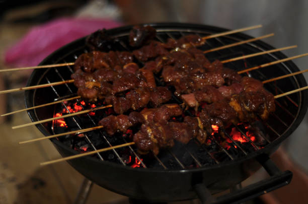 Beef satay during Eid al-Adha Muslims will feast on satay during Eid al-Adha. eid al adha stock pictures, royalty-free photos & images