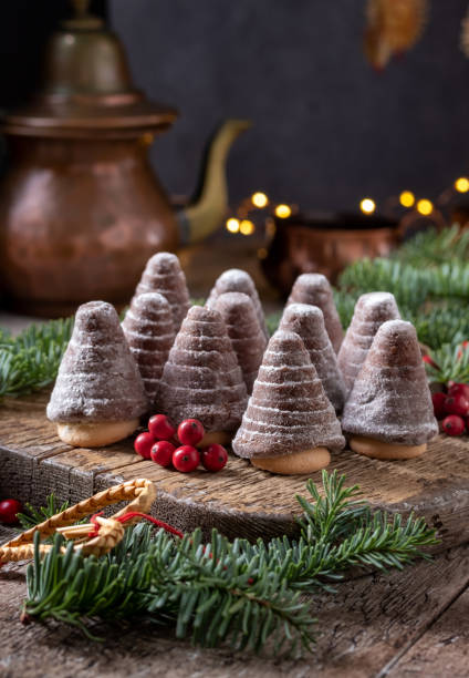 Beehives or wasp nests - traditional Czech Christmas cookies Beehives or wasp nests - traditional Czech Christmas cookies arranged on a wooden table czech culture stock pictures, royalty-free photos & images