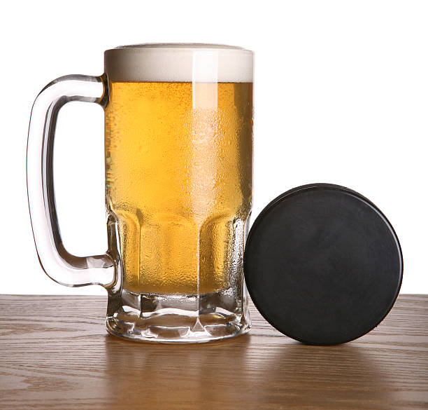 Beer and Hockey Puck stock photo