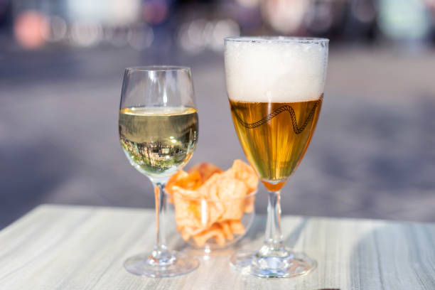 Beer and wine on a sunny terrace in Ghent, Belgium stock photo