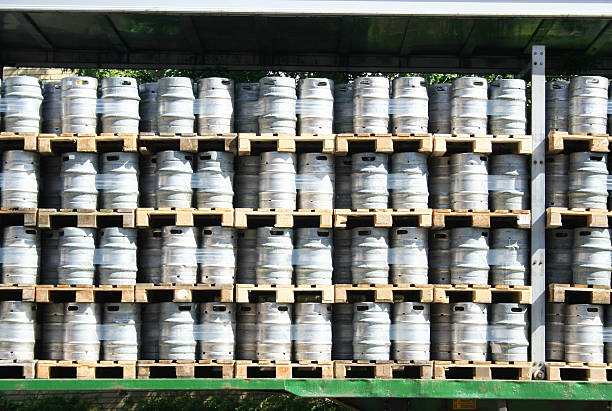 beer barrels in a stack stock photo